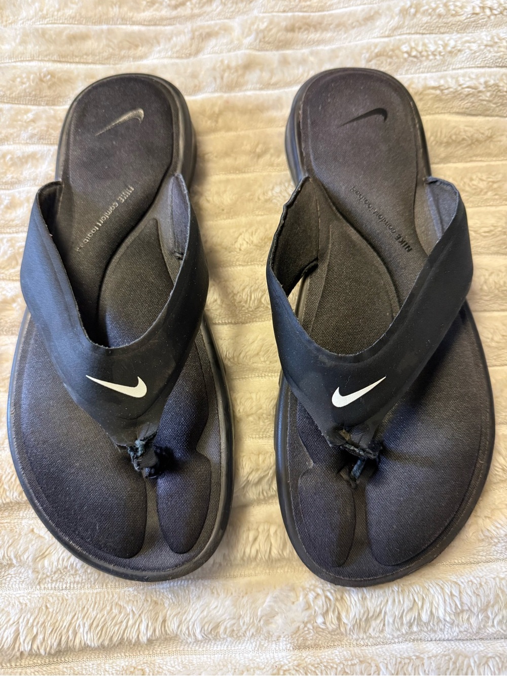 Nike Women’s Black Flip Flop Sandals with White Swoosh